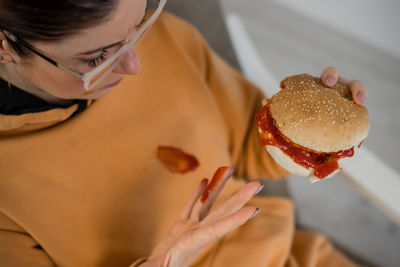 Midsection of woman holding ice cream