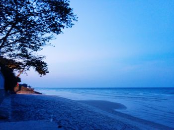 Scenic view of sea against clear blue sky