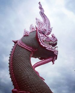 Low angle view of statue against sky