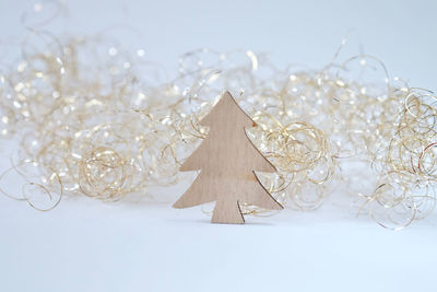 Wooden fir tree as a christmas decoration on white background.