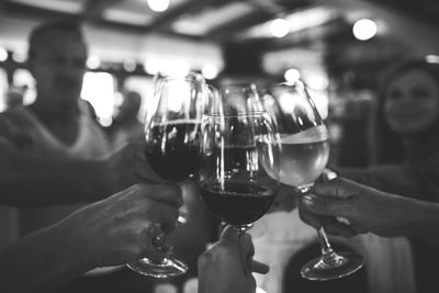 Close-up of cropped hand holding wine glass