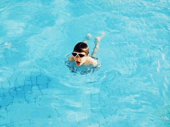 Boy swimming in pool