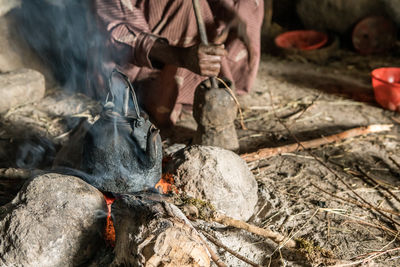 Low section of man making coffee