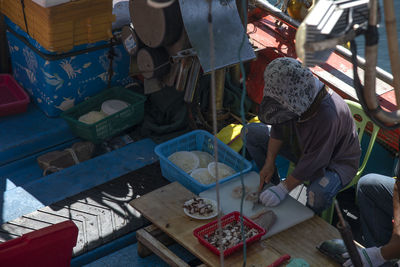 Man working at market stall