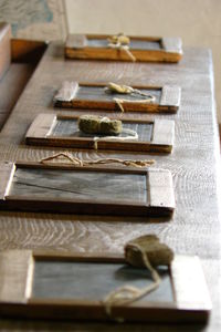 Slate with tied sponge on wooden table