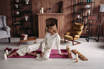 Woman sitting on floor