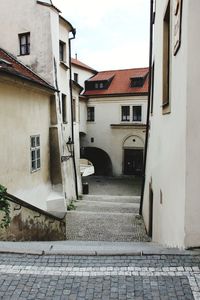 Footpath amidst buildings in town