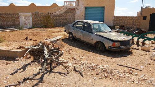 Abandoned car on building