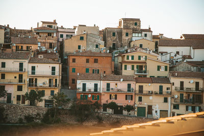 Buildings in city against clear sky