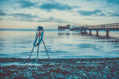 Close-up of photographing water against sky