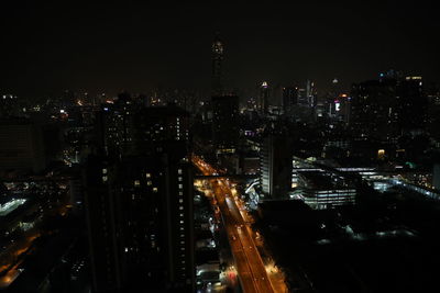 High angle view of illuminated buildings in city at night