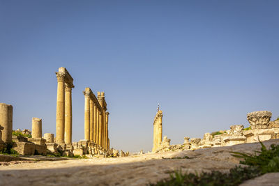 Low angle view of the pillars of the colonnaded street at the roman historical site