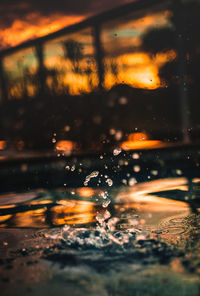 Close-up of water drops on car window during rainy season