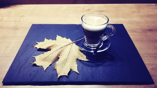 High angle view of coffee cup on table