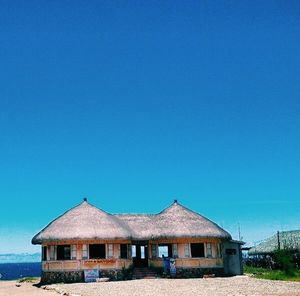 Houses against clear blue sky