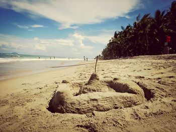 Scenic view of beach against sky