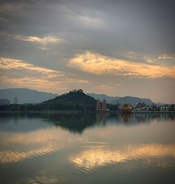 Scenic view of lake against sky during sunset