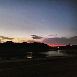 Scenic view of landscape against sky at sunset