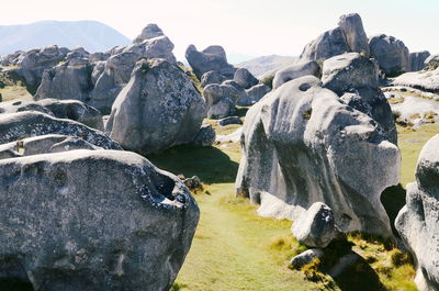 Panoramic view of people on beach against sky