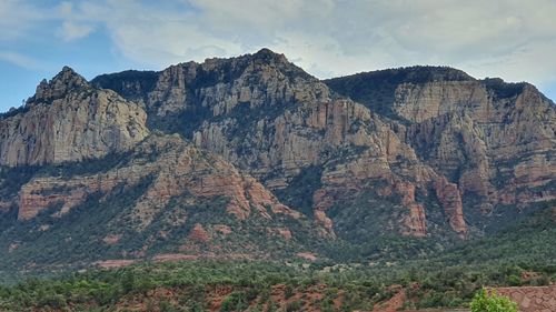 Scenic view of rocky mountains against sky