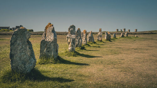 Panoramic view of megalithic stone structure on field against sky