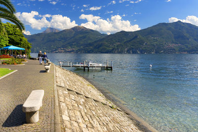 View of calm sea against mountain range