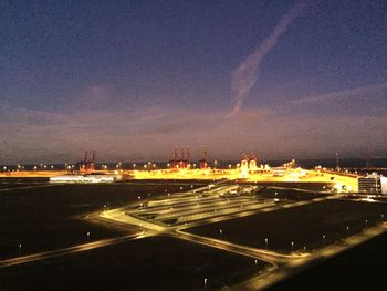 View of illuminated road at night