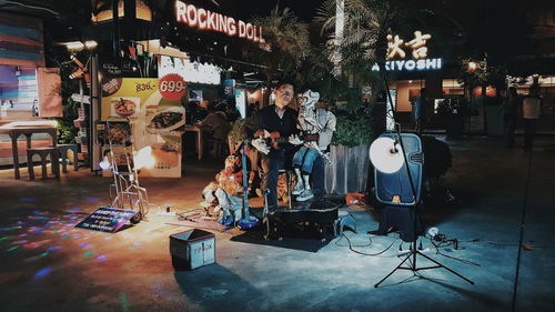 Illuminated lighting equipment on stage at night