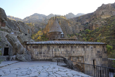 Built structure on mountain against sky