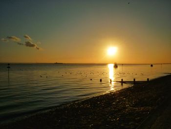 Scenic view of sea at sunset