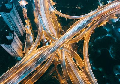 High angle view of light trails on road at night