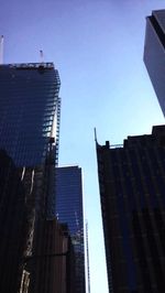 Low angle view of skyscrapers against sky