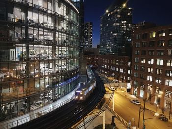 High angle view of illuminated buildings in city at night