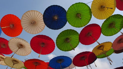 Low angle view of balloons against sky