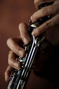 Cropped hand of man playing guitar