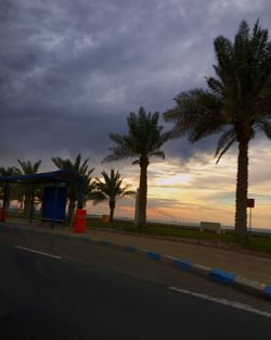 Road against cloudy sky at sunset