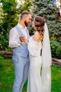 Rear view of couple standing outdoors