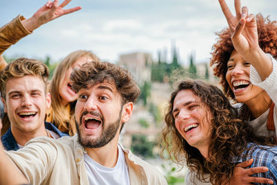 Cheerful friends enjoying festival