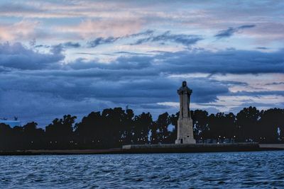 Statue of liberty against cloudy sky