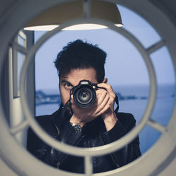 Portrait of man photographing