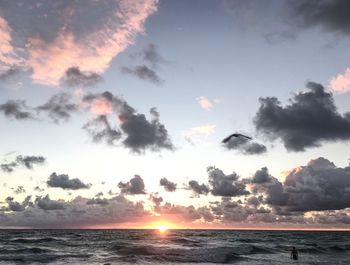 Scenic view of sea against sky at sunset