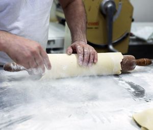 Midsection of man preparing food