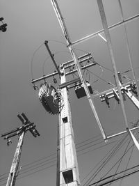 Low angle view of ferris wheel against sky