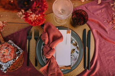 High angle view of red roses on table