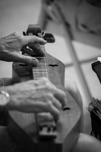 Close-up of man playing guitar