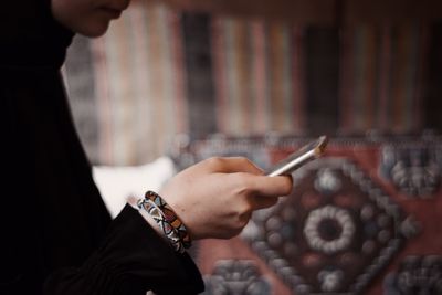 Midsection of woman holding hands