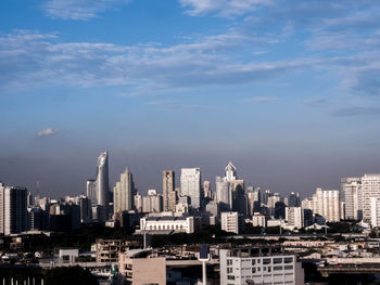 Modern buildings in city against sky