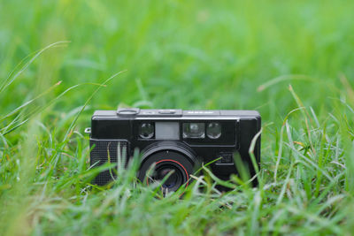 Close-up of camera on field