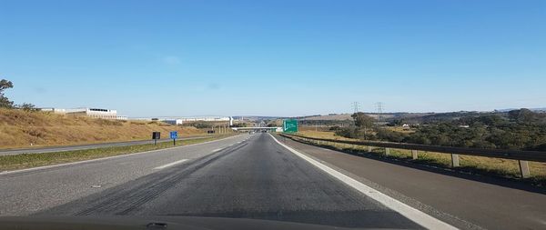 Road passing through against sky