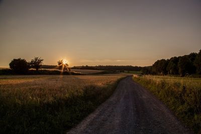 Road passing through field